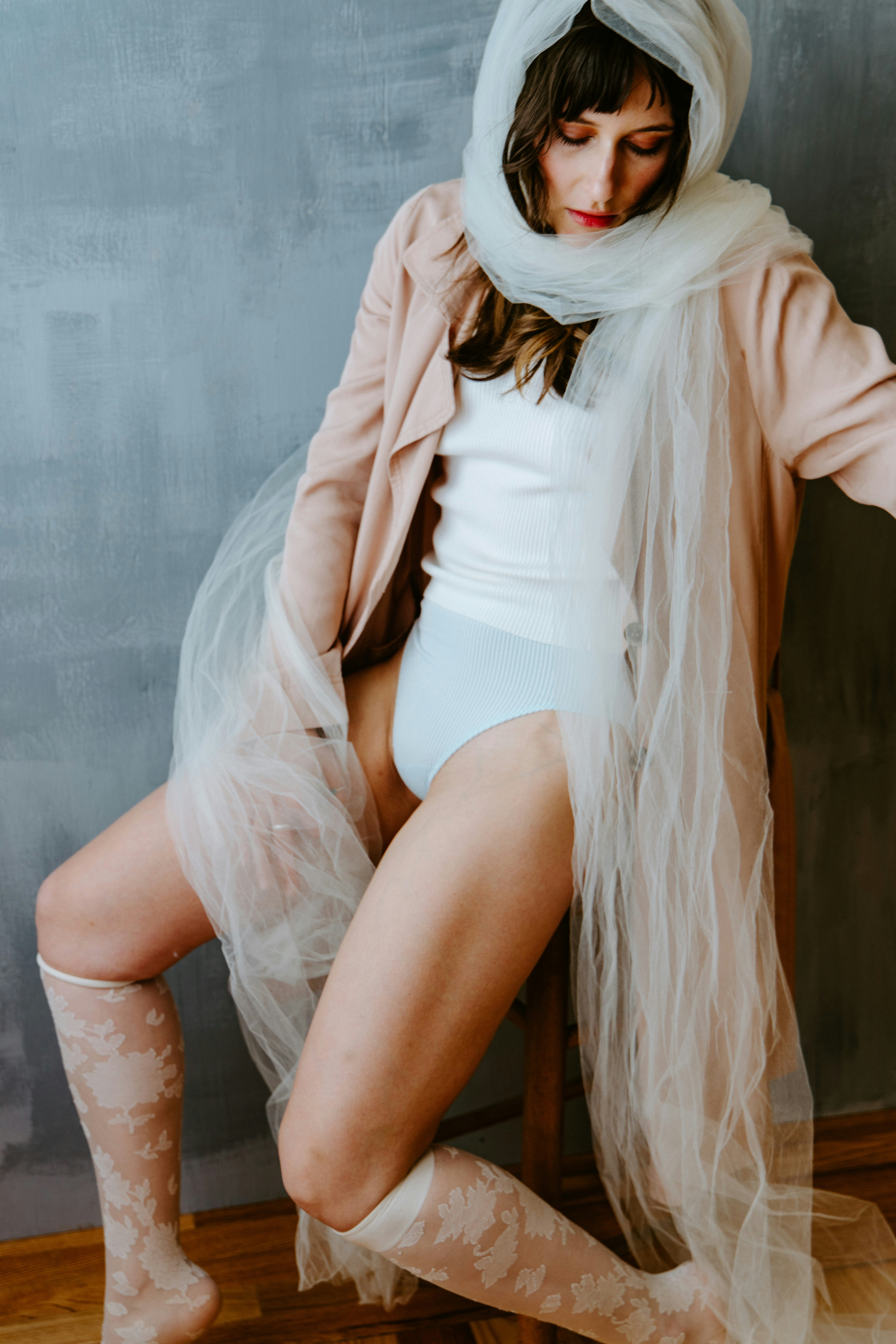 woman in white dress and brown cardigan